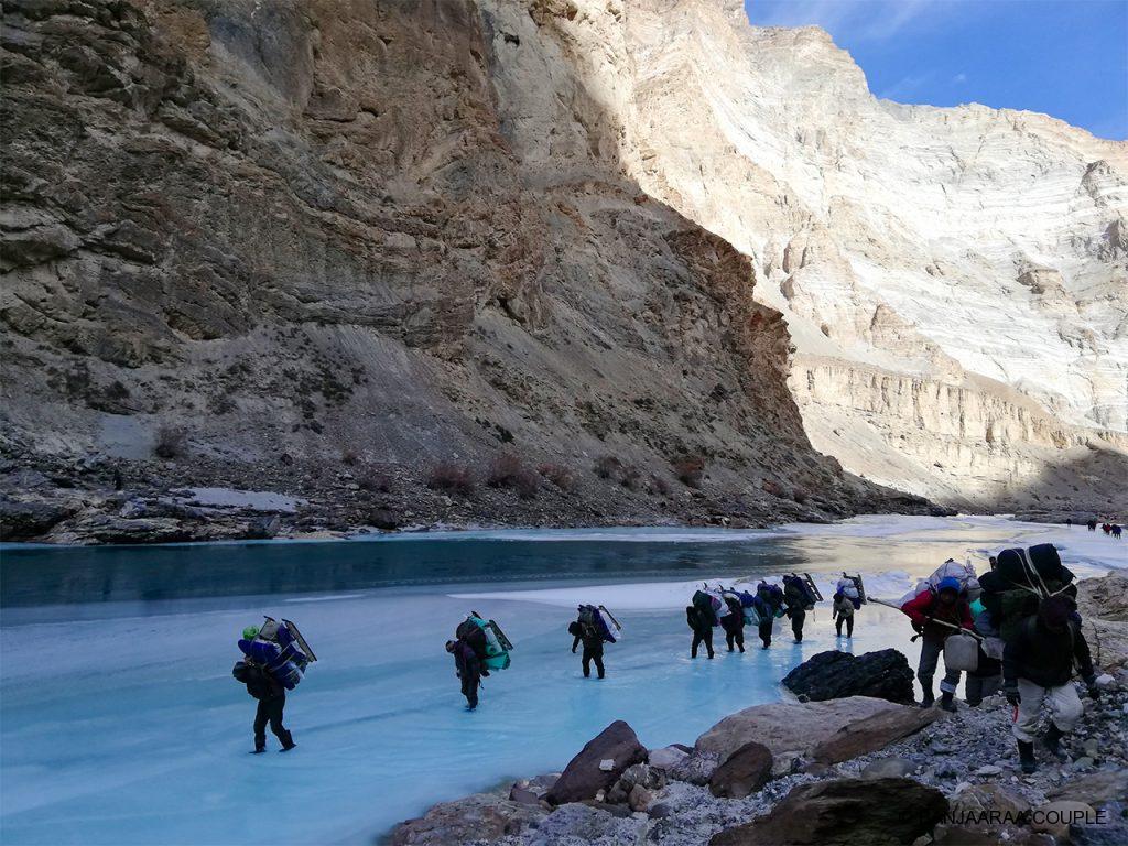 A walk on the frozen river - porters carrying the essentials
