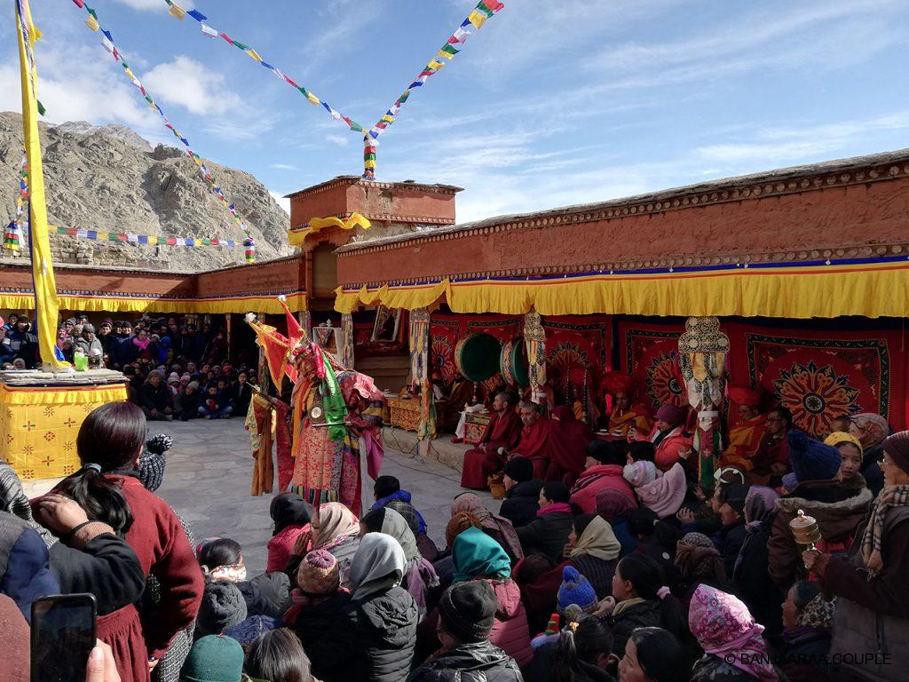 A monk dancing in the festival wearing full attire